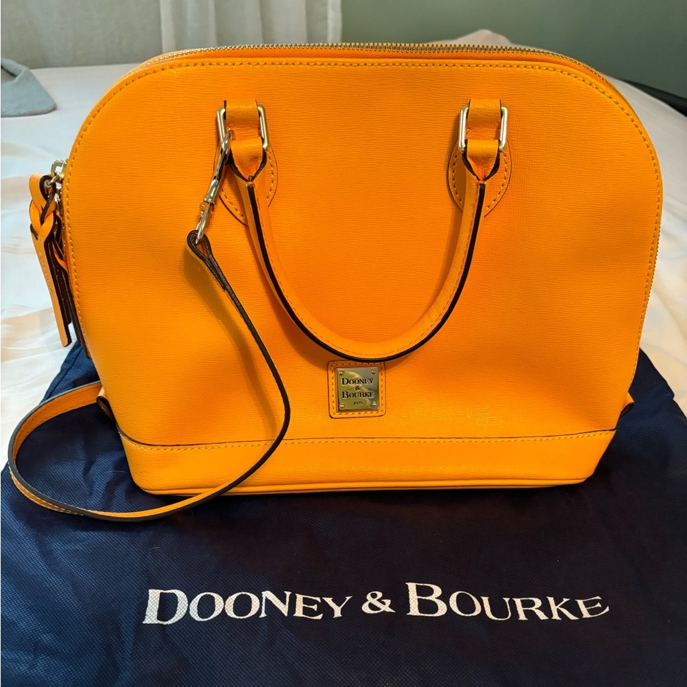 Dooney and Bourke zip zip satchel in a beautiful orange creamsicle.